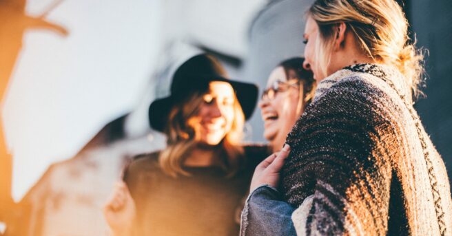 Group of individuals talking and laughing
